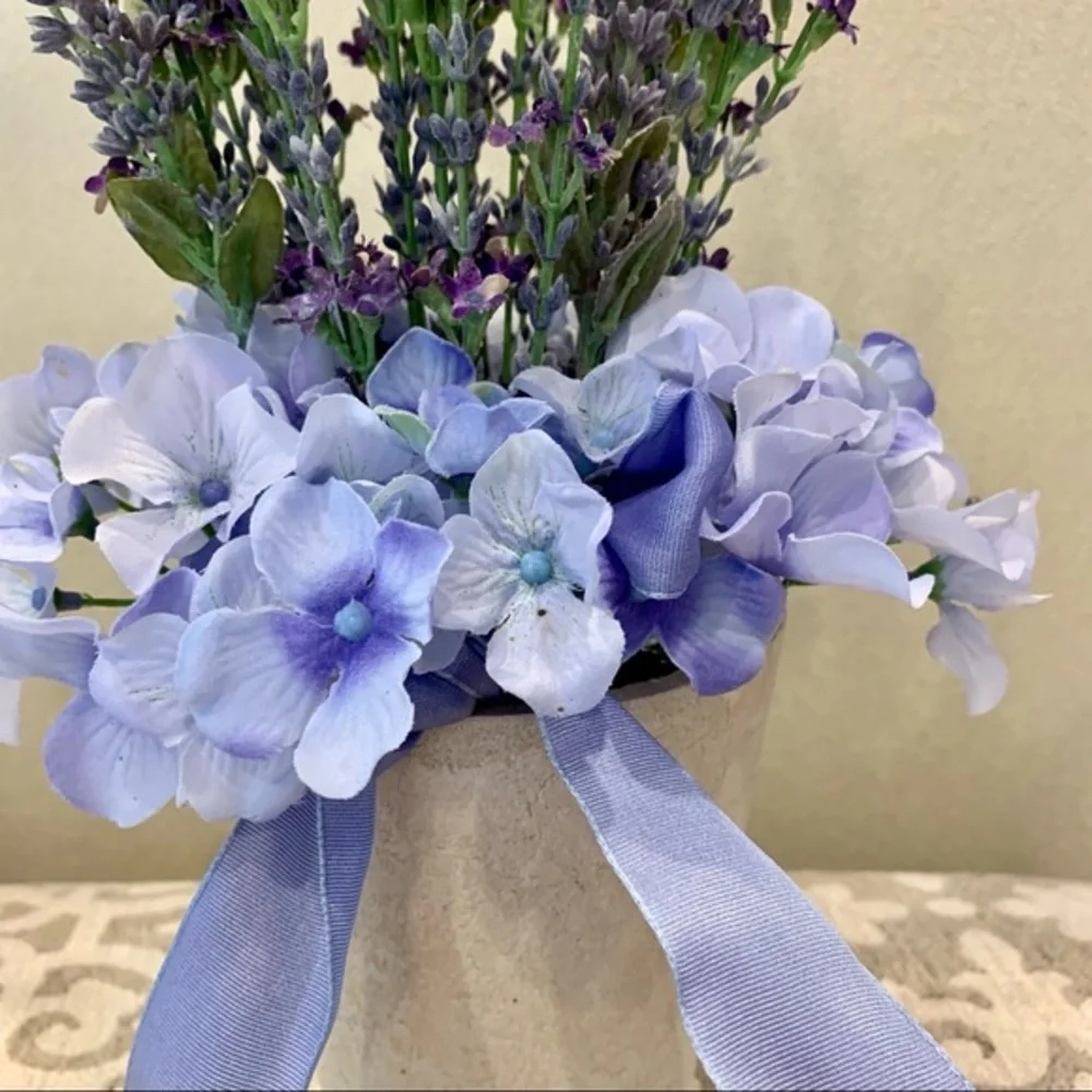 Purple Flowers in Cream Resin Vase‎